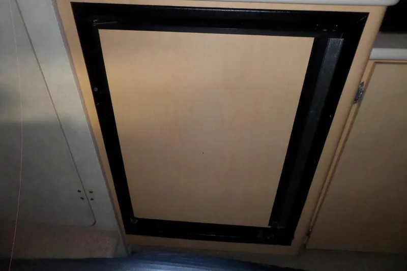Slide: The Image of Cabinet door inside a 2000 Bayliner 3055 Ciera boat interior. - 39