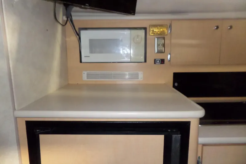 Slide: The Image of Interior of 2000 Bayliner 3055 Ciera with microwave and cabinetry. - 40