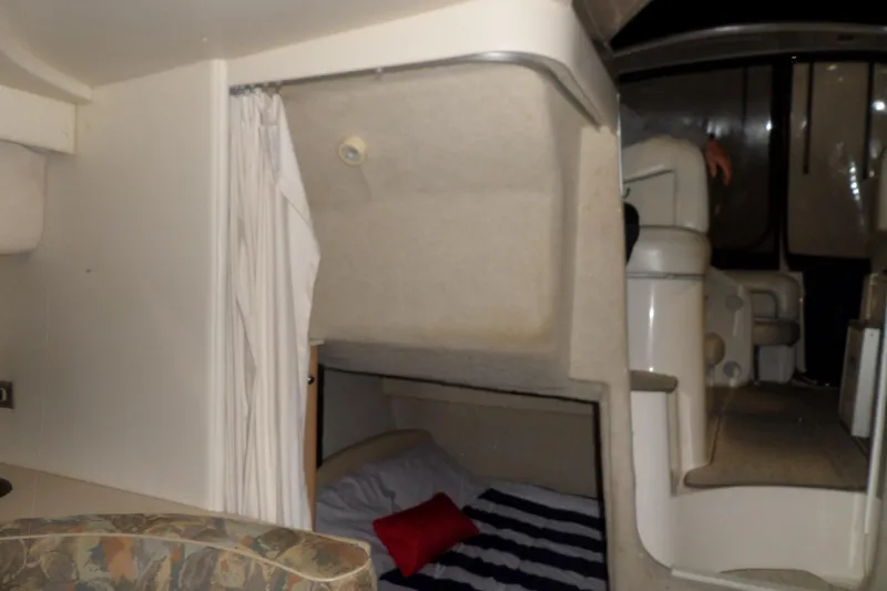 Slide: The Image of Interior cabin of a 2000 Bayliner 3055 Ciera boat with bed and seating area. - 44