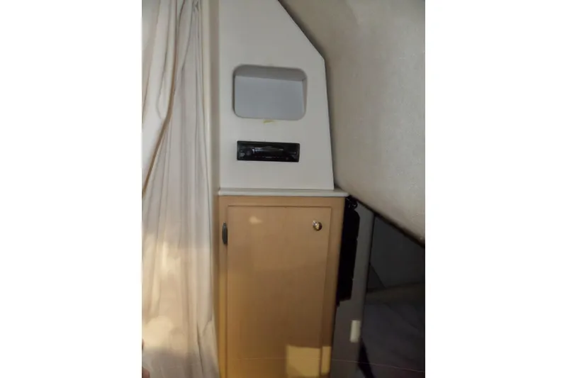 Slide: The Image of Interior cabin of 2000 Bayliner 3055 Ciera boat with storage cabinet. - 46