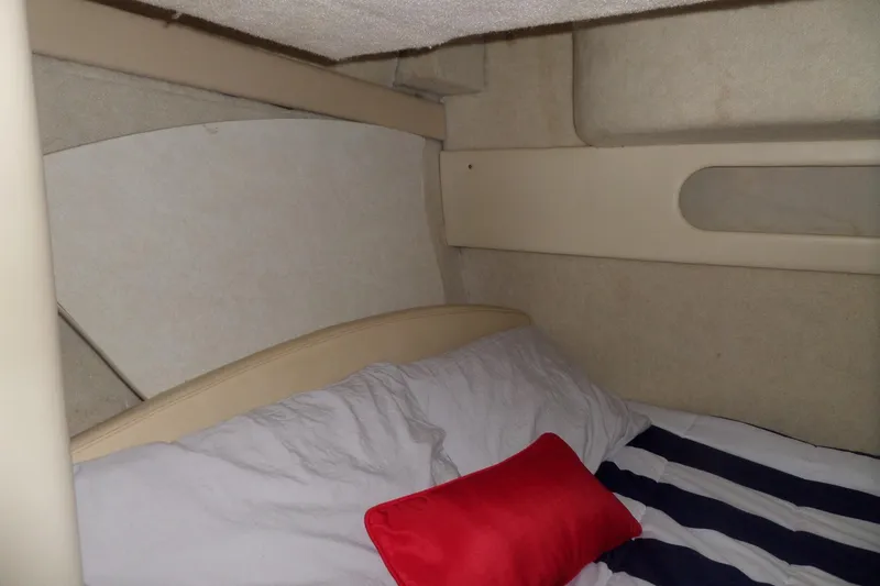 Slide: The Image of Interior cabin of 2000 Bayliner 3055 Ciera with bed and red pillow. - 47