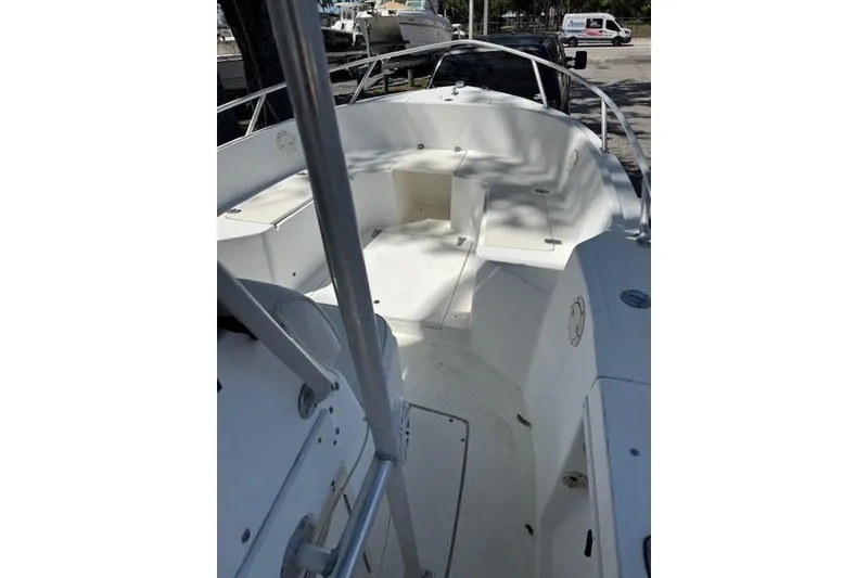 Slide: The Image of 1999 Mako 221 Center Console boat interior with seating and storage compartments. - 5