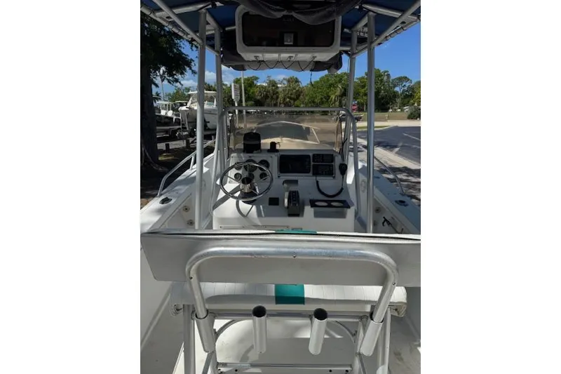 Slide: The Image of 1999 Mako 221 Center Console boat interior with steering wheel and controls. - 8