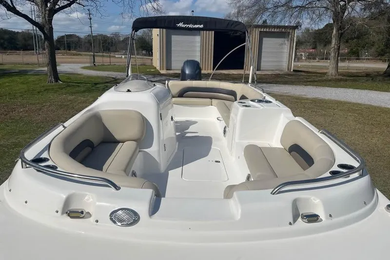 Slide: The Image of 2017 Hurricane SunDeck Sport 232 OB boat with spacious seating and sleek design. - 4