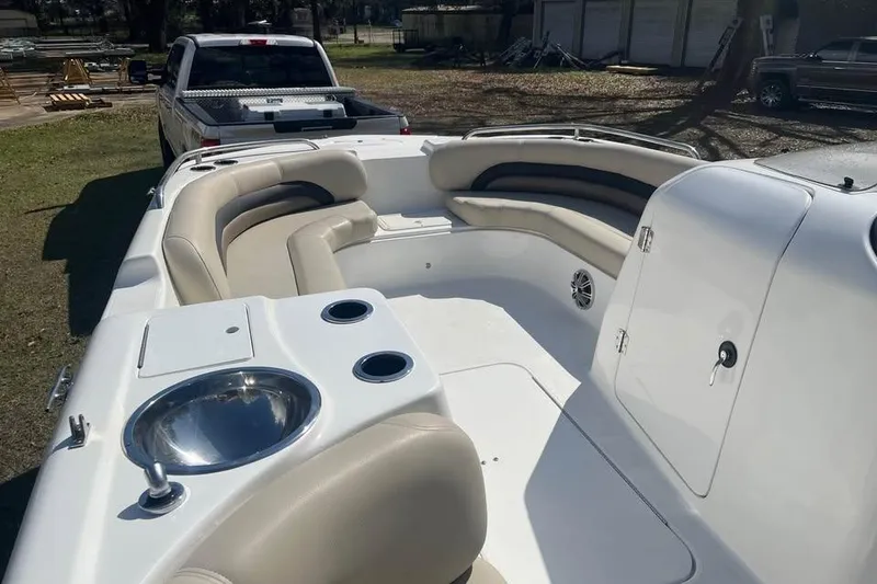 Slide: The Image of 2017 Hurricane SunDeck Sport 232 OB boat interior with seating and sink. - 9