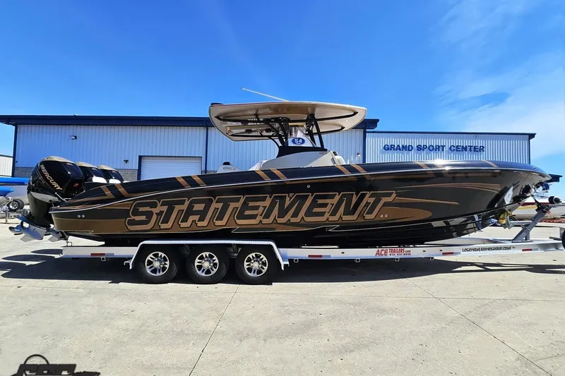 The Image of 2017 Statement 380 Open boat on trailer at Grand Sport Center, featuring bold design and Mercury engines. - 0