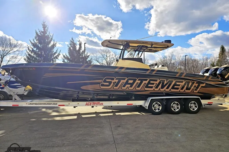 Slide: The Image of 2017 Statement 380 Open boat on trailer under blue sky with clouds. - 12
