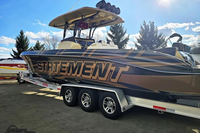 Slide: The Image of 2017 Statement 380 Open boat on trailer under clear sky. - 13