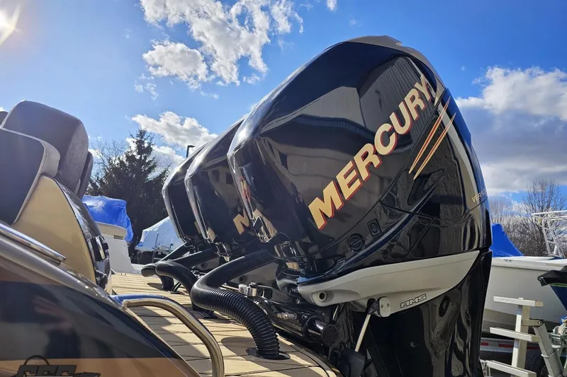 Slide: The Image of 2017 Statement 380 Open boat with Mercury outboard engines under a bright blue sky. - 14
