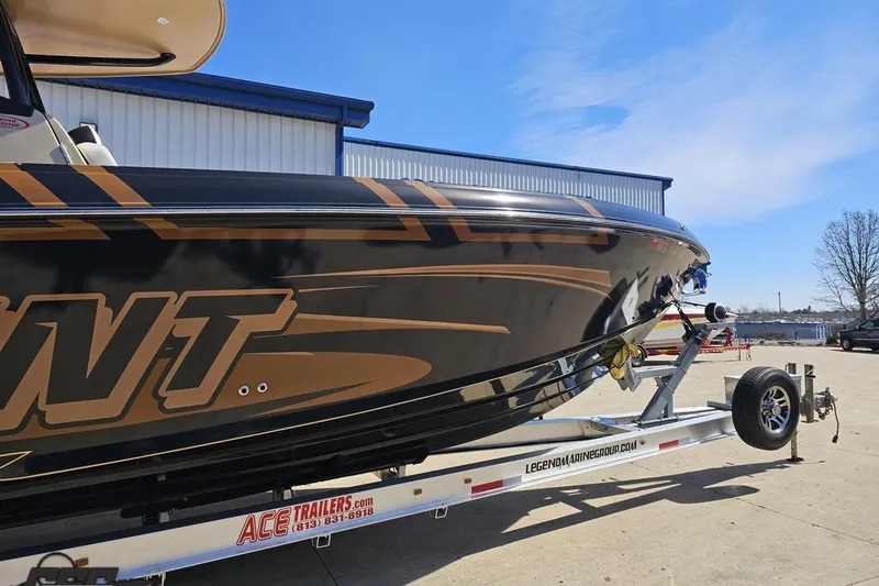 Slide: The Image of 2017 Statement 380 Open boat on trailer, sleek design, parked outdoors. - 2