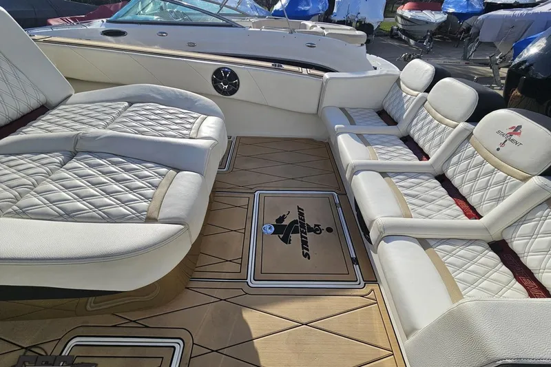 Slide: The Image of Luxurious interior of a 2017 Statement 380 Open boat with quilted seating and wood flooring. - 22