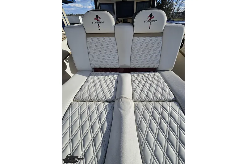 Slide: The Image of Luxurious seating on a 2017 Statement 380 Open boat with diamond-pattern upholstery. - 26