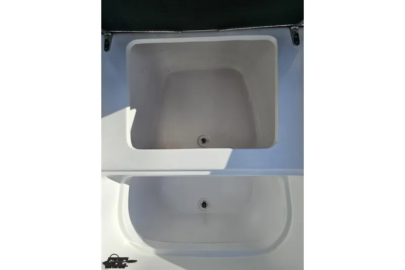 Slide: The Image of Two empty compartments on a 2017 Statement 380 Open boat. - 27