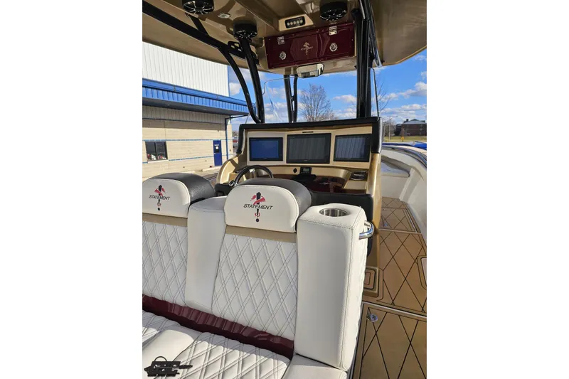 Slide: The Image of 2017 Statement 380 Open boat interior with luxurious seating and advanced navigation displays. - 29