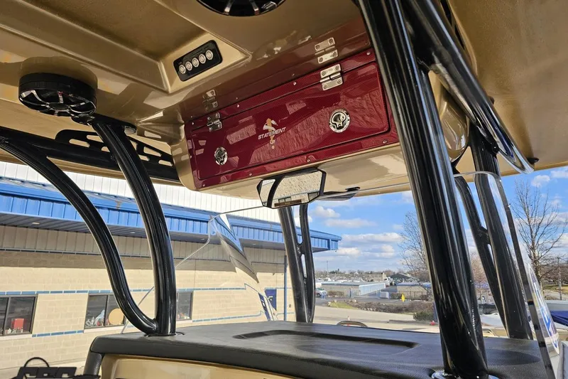 Slide: The Image of Interior view of a 2017 Statement 380 Open boat with red storage compartment. - 36