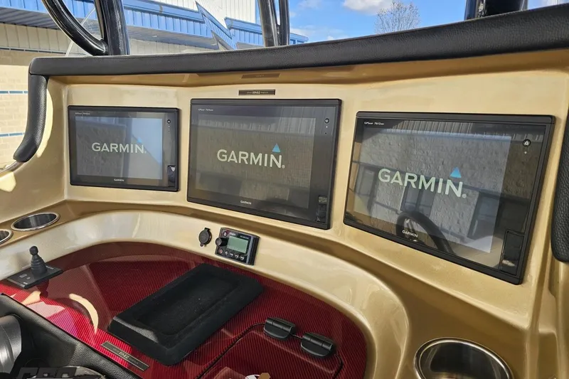 Slide: The Image of Dashboard of 2017 Statement 380 Open with three Garmin displays. - 38