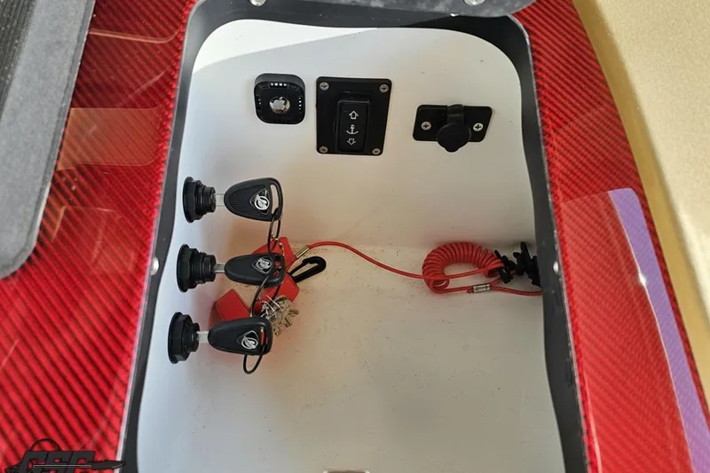 Slide: The Image of Control panel inside 2017 Statement 380 Open boat with red accents and switches. - 41