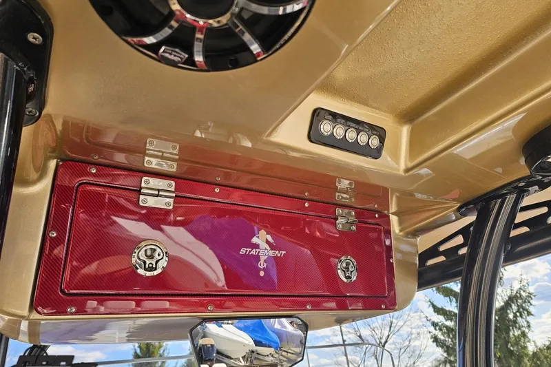Slide: The Image of Red storage compartment on 2017 Statement 380 Open boat with speaker and control panel. - 46