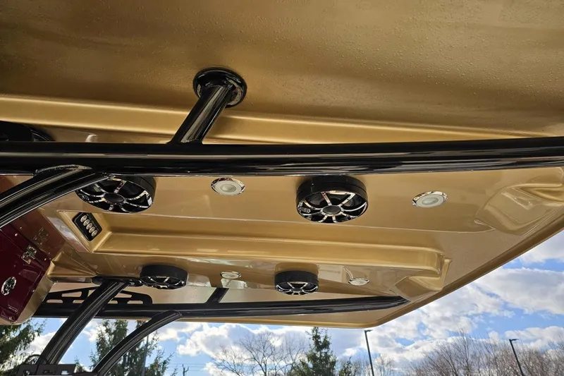 Slide: The Image of 2017 Statement 380 Open boat roof with speakers and lights against a blue sky. - 47