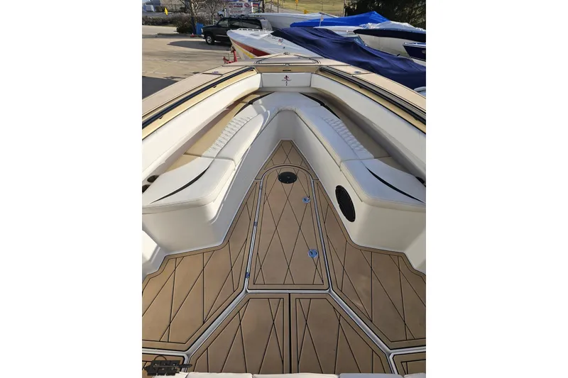 Slide: The Image of 2017 Statement 380 Open boat interior with cushioned seating and wood-patterned flooring. - 53