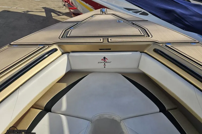 Slide: The Image of 2017 Statement 380 Open boat interior with beige and white seating. - 56
