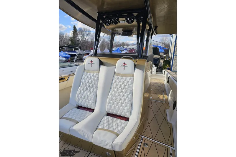 Slide: The Image of Luxurious interior of a 2017 Statement 380 Open boat with diamond-stitched seating. - 64