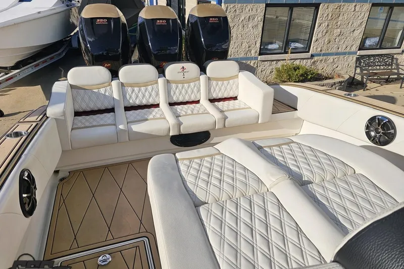 Slide: The Image of Luxurious 2017 Statement 380 Open boat interior with quilted white seating and powerful engines. - 68