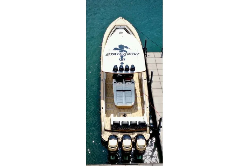 Slide: The Image of Aerial view of 2017 Statement 380 Open boat docked on clear blue water. - 77