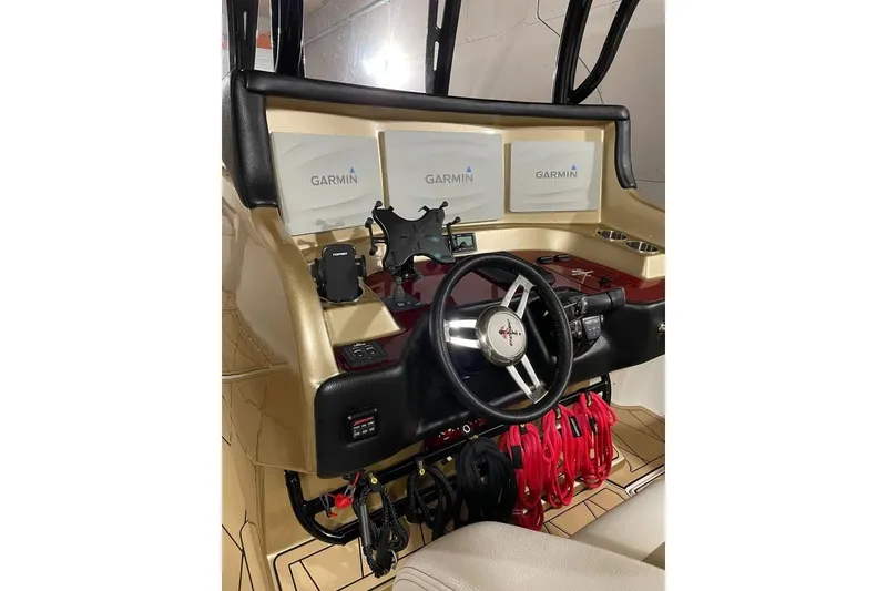 Slide: The Image of Helm of 2017 Statement 380 Open boat with Garmin displays and steering wheel. - 79