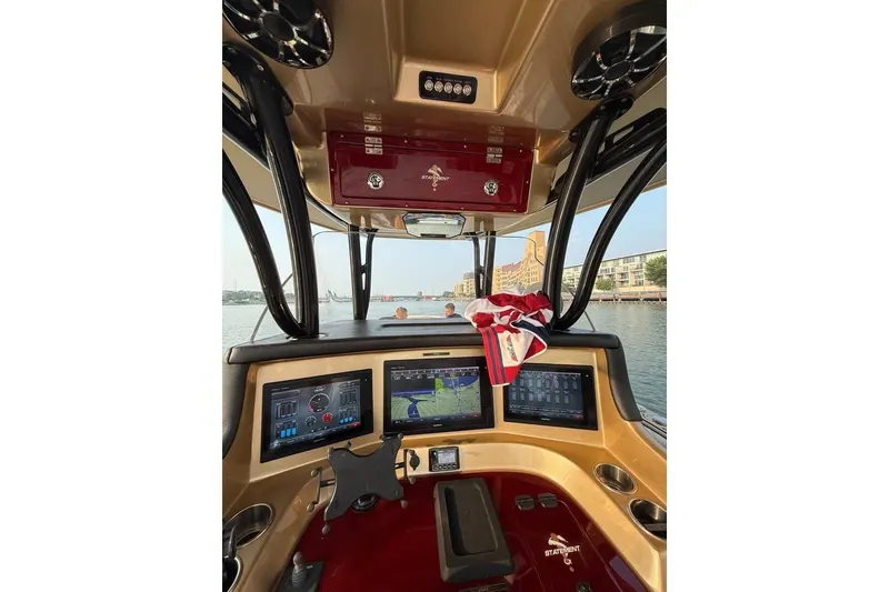 Slide: The Image of Cockpit view of 2017 Statement 380 Open boat with navigation screens. - 80
