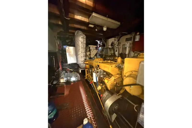 Slide: The Image of Engine room of a 1971 Philbrooks Trawler, showcasing machinery and equipment. - 12