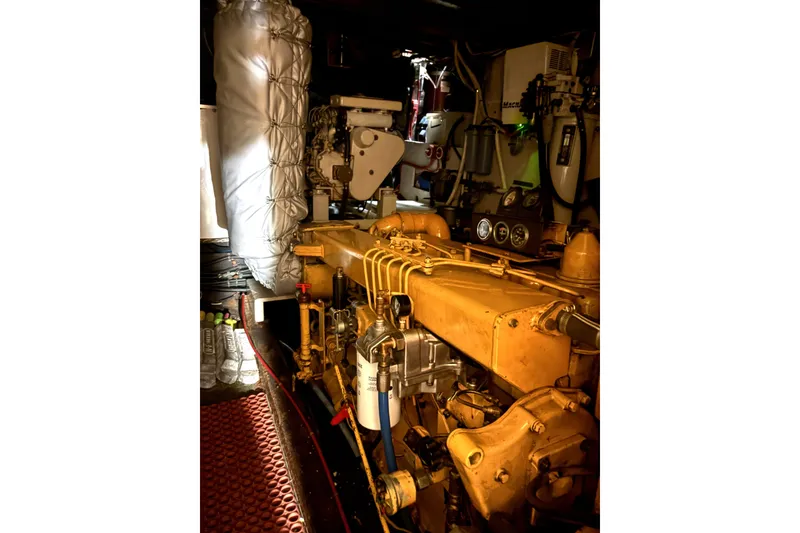 Slide: The Image of Engine room of a 1971 Philbrooks Trawler with visible machinery and equipment. - 13