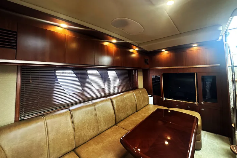 Slide: The Image of Luxurious interior of 2006 Sea Ray 48 Sundancer yacht with leather seating and wood finishes. - 18
