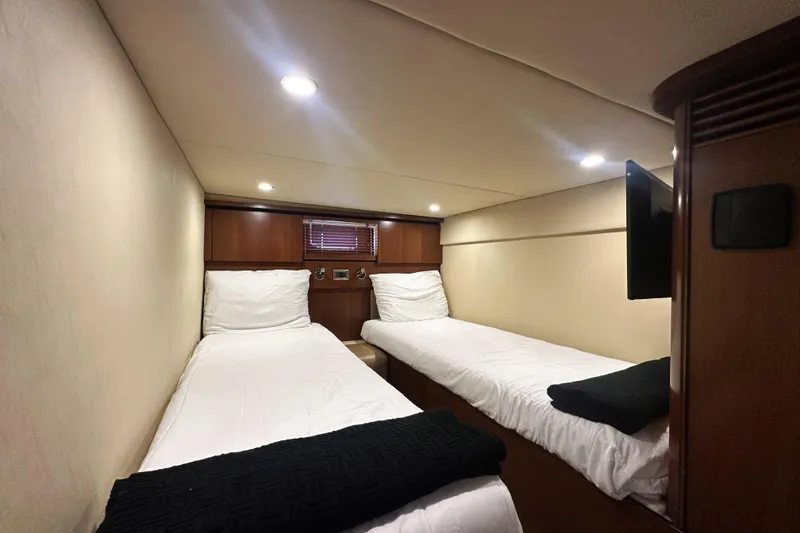 Slide: The Image of Twin cabin interior of 2006 Sea Ray 48 Sundancer yacht with modern lighting. - 23