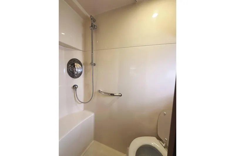 Slide: The Image of Luxurious bathroom in 2006 Sea Ray 48 Sundancer yacht, featuring modern shower and toilet. - 26