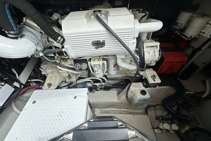 Slide: The Image of Engine room of a 2006 Sea Ray 48 Sundancer, showcasing detailed mechanical components. - 27