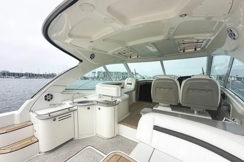 Slide: The Image of Luxurious interior of 2006 Sea Ray 48 Sundancer yacht with modern amenities and waterfront view. - 5