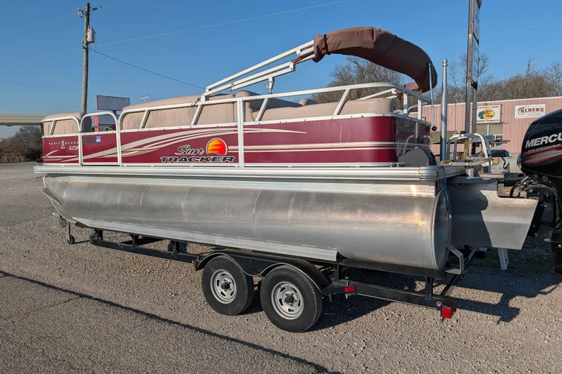 Slide: The Image of 2014 Sun Tracker Party Barge 22 XP3 pontoon boat on trailer, parked outdoors. - 30