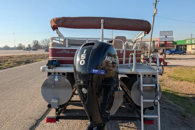 Slide: The Image of 2014 Sun Tracker Party Barge 22 XP3 with Mercury 150 engine, parked outdoors. - 32