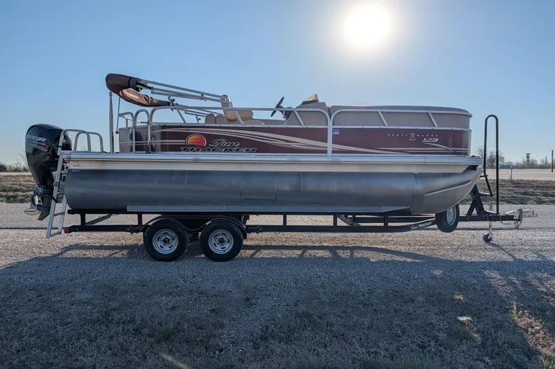 Slide: The Image of 2014 Sun Tracker Party Barge 22 XP3 pontoon boat on trailer under bright sun. - 35
