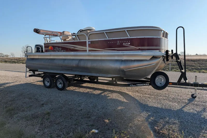 Slide: The Image of 2014 Sun Tracker Party Barge 22 XP3 pontoon boat on trailer, parked on gravel. - 36