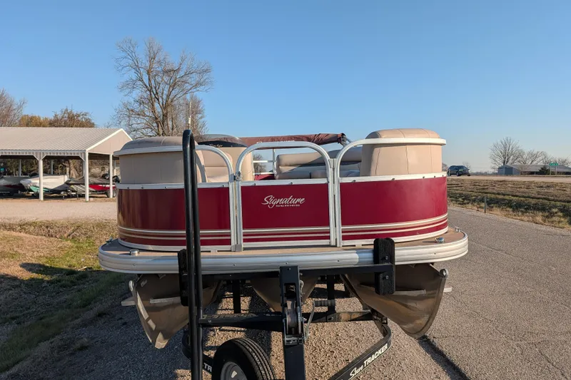 Slide: The Image of 2014 Sun Tracker Party Barge 22 XP3 pontoon boat on trailer, parked outdoors. - 37