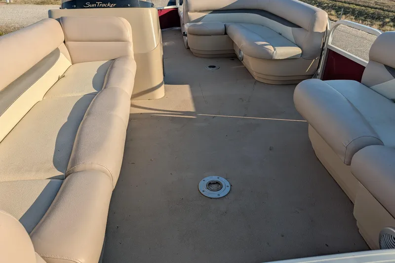 Slide: The Image of 2014 Sun Tracker Party Barge 22 XP3 interior with beige seating and open deck space. - 39