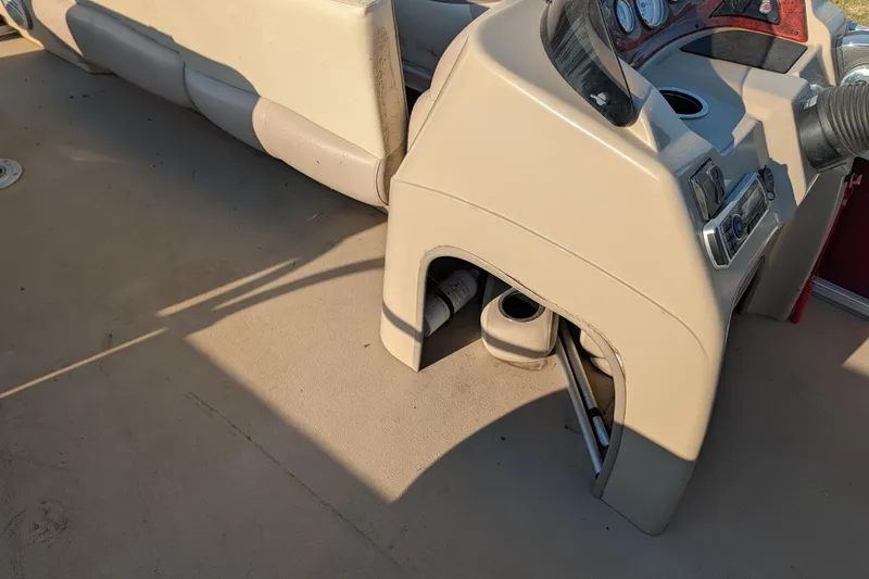 Slide: The Image of 2014 Sun Tracker Party Barge 22 XP3 interior with beige seating and control panel. - 47