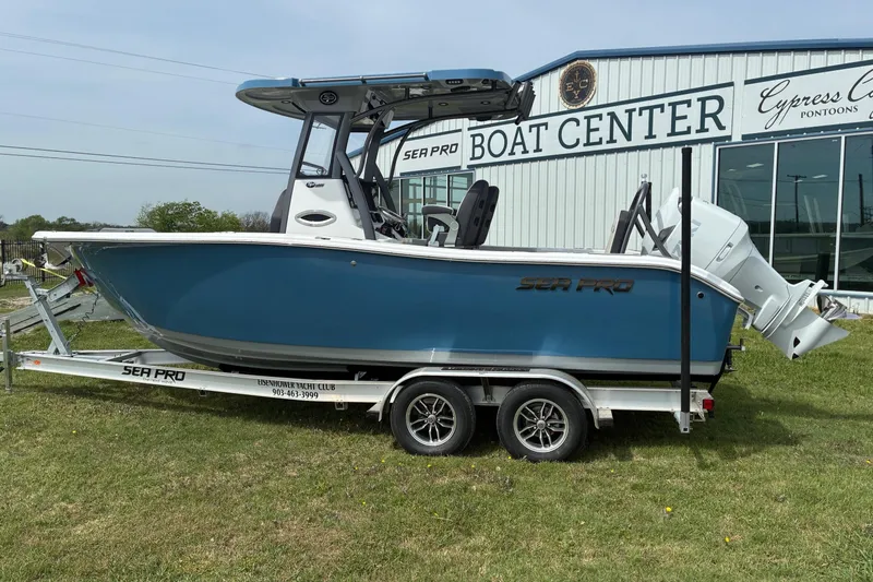 The Image of 2026 Sea Pro 245FLX Sandbar boat on trailer at boat center, side view. - 1