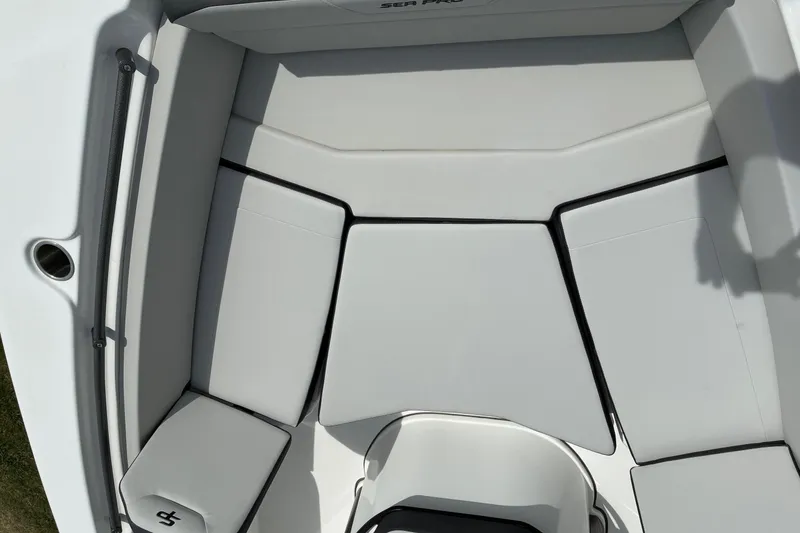 Slide: The Image of 2026 Sea Pro 245FLX Sandbar boat interior with cushioned seating area. - 12