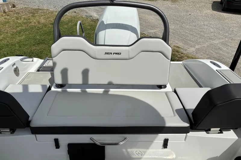 Slide: The Image of 2026 Sea Pro 245FLX Sandbar boat interior with cushioned seating and sleek design. - 23