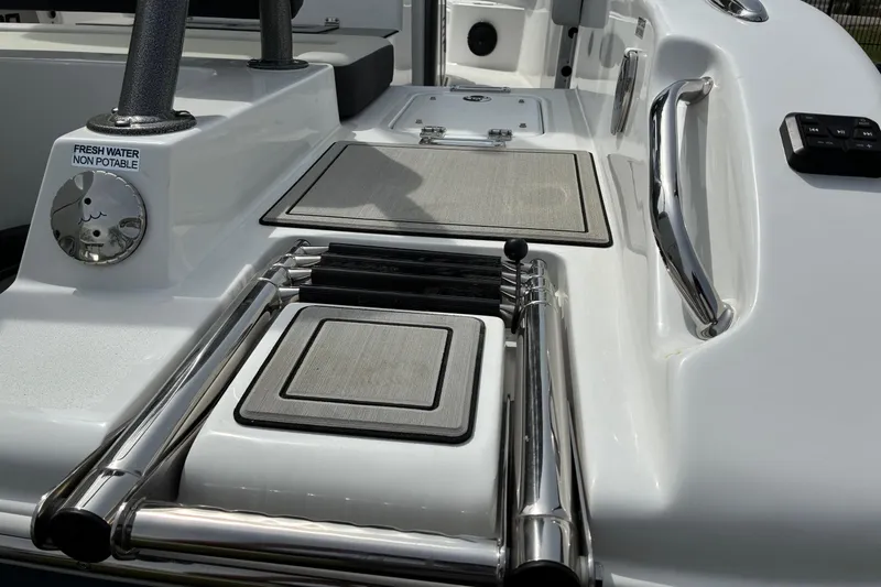 Slide: The Image of 2026 Sea Pro 245FLX Sandbar boat deck with non-potable water access and sleek design. - 5