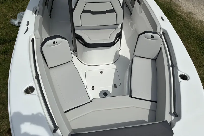 Slide: The Image of 2026 Sea Pro 245FLX Sandbar boat interior with cushioned seating and sleek design. - 8