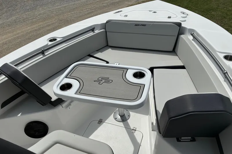 Slide: The Image of 2026 Sea Pro 245FLX Sandbar boat interior with seating and table. - 9